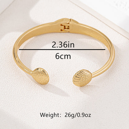 SILUEEN™ - Bracciale aperto in conchiglia dorata 